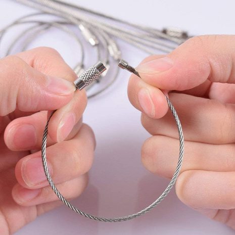 photo of hands holding 6-inch wire cable with screw closure