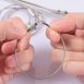 photo of hands holding 6-inch wire cable with screw closure