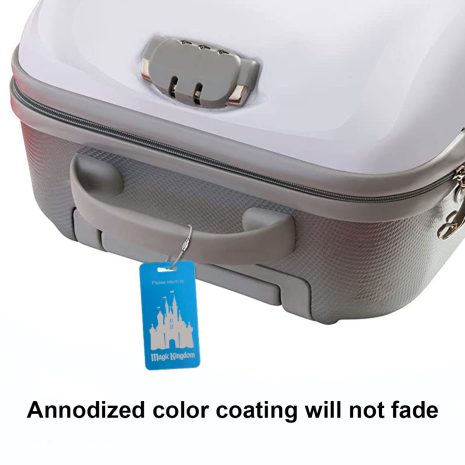 photo of sample engraved aluminum luggage tag attached to suitcase